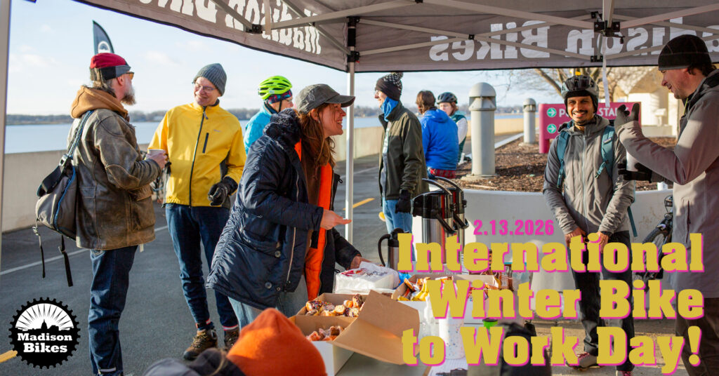 Photo from a previous Winter Bike to Work Day event, with overlaid text: 2/13/2026. International Winter Bike to Work Day. The Madison Bikes logo is in the corner.